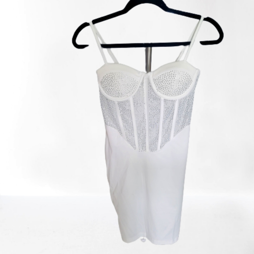 Beautiful brand new never worn white mini dress. Excellent for a birthday dress